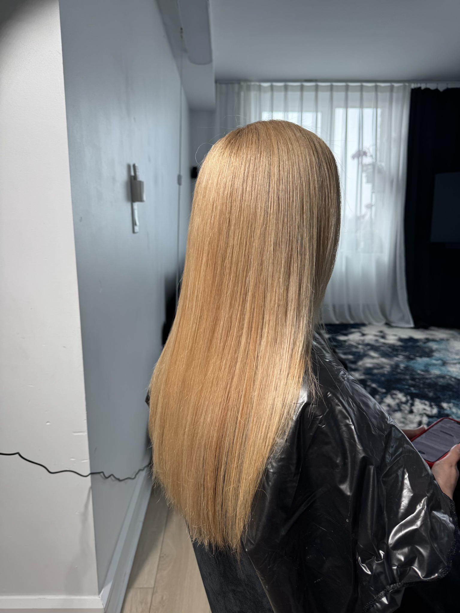 After: blonde hair showing a smoother appearance and finished styling